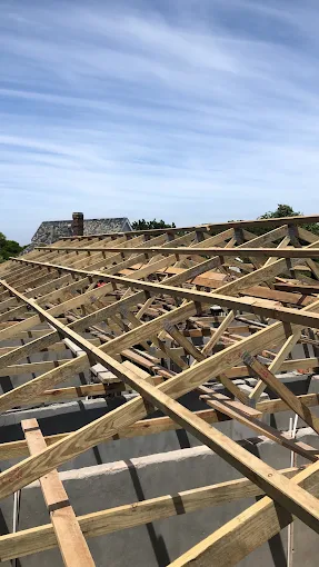 Timber roof trusses braced and tied together before the covering goes on