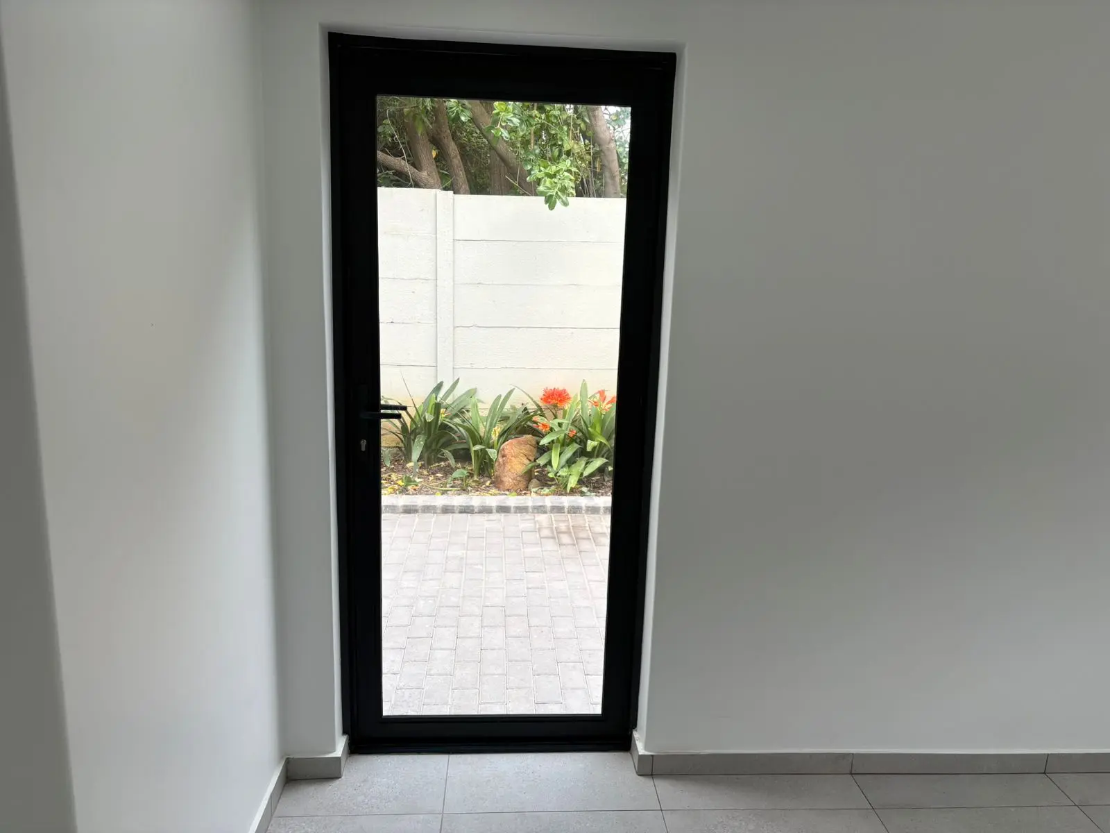 New black-framed exterior door installation