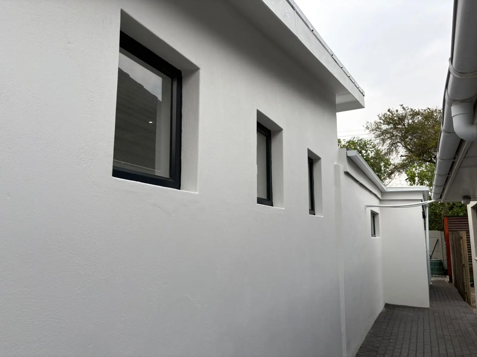 Black-framed windows along the exterior wall